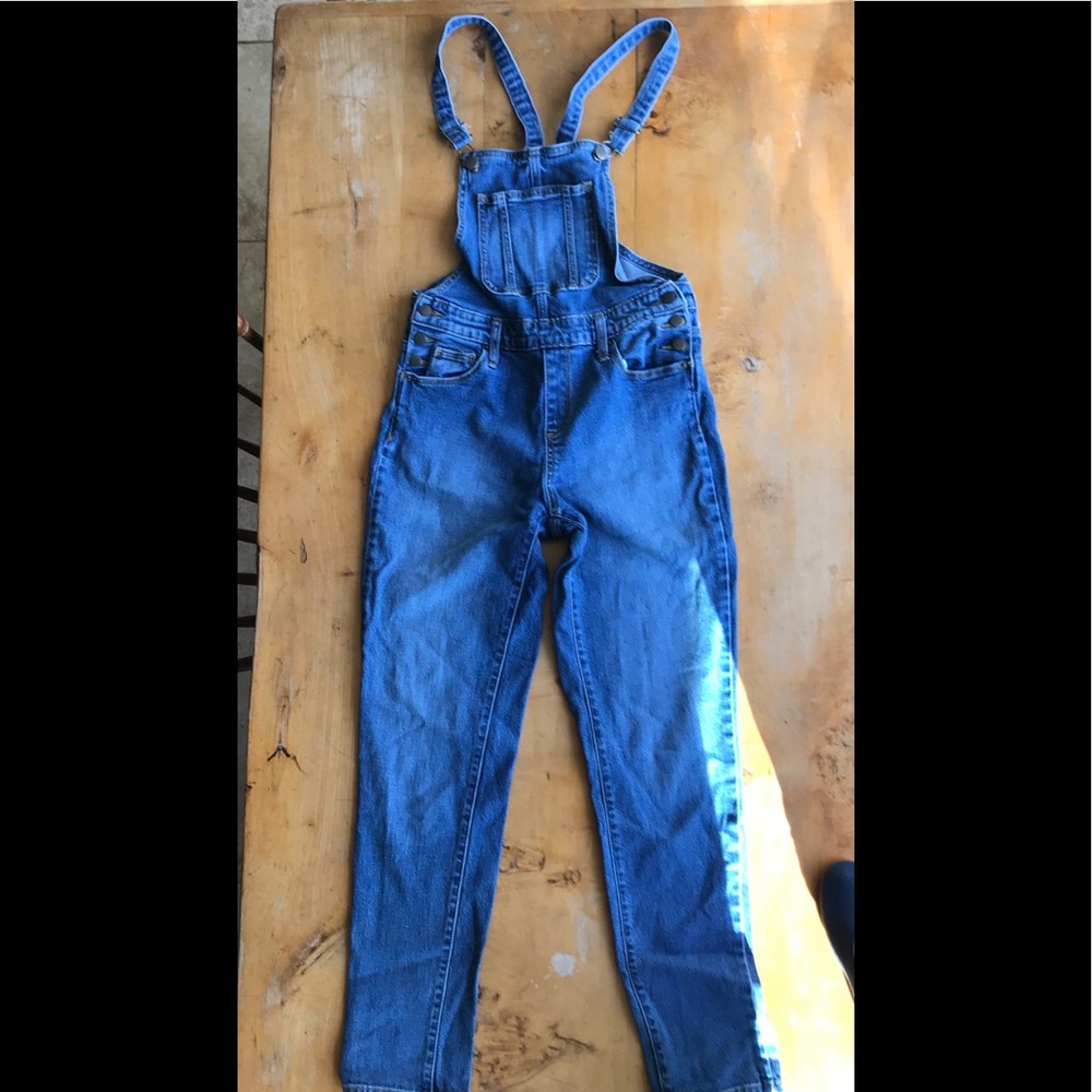 Overalls with thin straps.